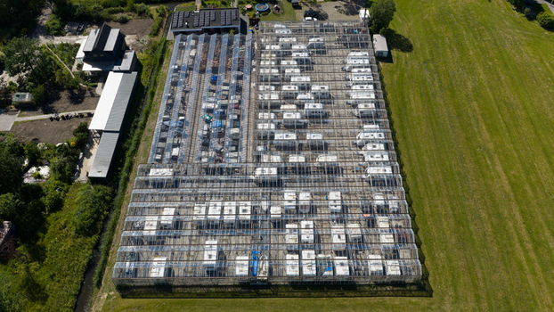 Aerial view of Caravanstalling Klijn a large glass greenhouse structure used for storing numerous caravans and campers in the rural landscape of Alkmaar Noord Holland Netherlands. Aerial view of Caravanstalling Klijn a large glass greenhouse structure used for storing numerous caravans and campers in the rural landscape of Alkmaar Noord Holland Netherlands.