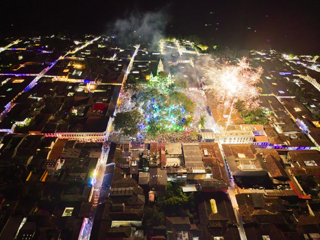 Aerial view of a dazzling spectacle of fireworks exploding above the central plaza illuminating the colonial architecture with vibrant colors Salamina Caldas Colombia. Aerial view of a dazzling spectacle of fireworks exploding above the central plaza illuminating the colonial architecture with vibrant colors Salamina Caldas Colombia.