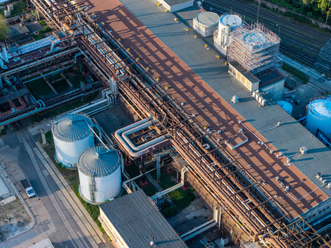 Aerial view of the Heizkraftwerk Klingenberg combined heat and power plant featuring industrial storage tanks and complex pipe networks in Berlin Berlin Germany. Aerial view of the Heizkraftwerk Klingenberg combined heat and power plant featuring industrial storage tanks and complex pipe networks in Berlin Berlin Germany.