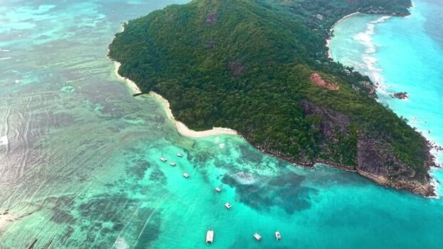 Aerial view of Praslin island and turquoise waters Seychelles. Aerial view of Praslin island and turquoise waters Seychelles.