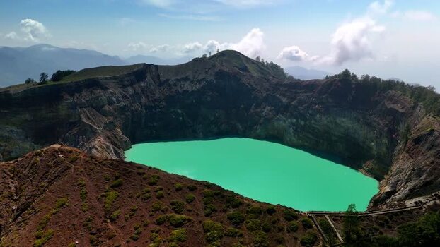 Aerial view of the turquoise crater lake of Kelimutu National Park Indonesia. Aerial view of the turquoise crater lake of Kelimutu National Park Indonesia.