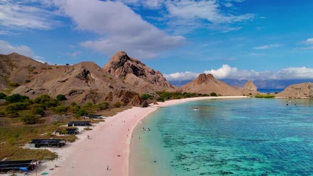 Aerial view of Pink Beach and rugged hills in Komodo National Park Indonesia. Aerial view of Pink Beach and rugged hills in Komodo National Park Indonesia.