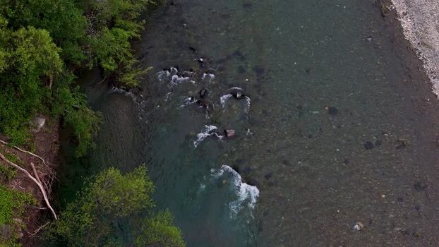 Aerial view of a clear river flowing over rocks United States. Aerial view of a clear river flowing over rocks United States.