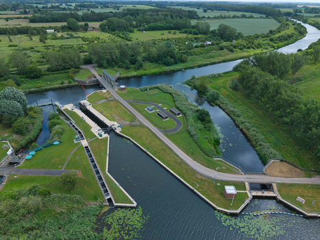 Aerial view of the Denver Sluice complex with river channels and green fields in Downham Market England United Kingdom.