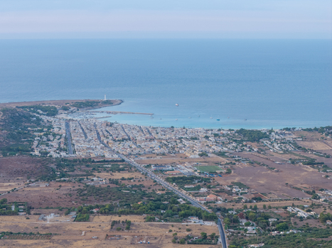 Aerial view of the coastal town with white buildings harbour and turquoise sea near the Riserva Naturale Orientata dello Zingaro San Vito Lo Capo Sicilia Italy. Aerial view of the coastal town with white buildings harbour and turquoise sea near the Riserva Naturale Orientata dello Zingaro San Vito Lo Capo Sicilia Italy.