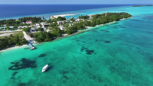 Aerial view of Fulhadhoo island with turquoise waters in Maldives. Aerial view of Fulhadhoo island with turquoise waters in Maldives.