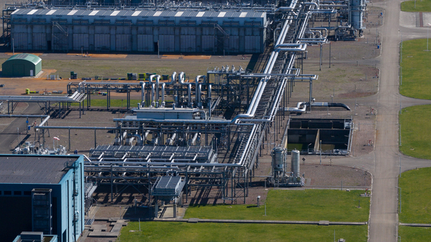 Aerial view of the NAM Grijpskerk UGS industrial facility with complex piping networks and large storage buildings Grijpskerk Groningen Netherlands.