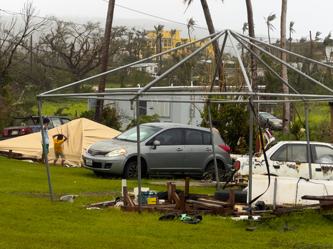 San Jose Tinian Northern Mariana Islands 06 July 2026 View of storm damage from Super Typhoon Bavi showing debris damaged structures and a makeshift shelter in a residential area. San Jose Tinian Northern Mariana Islands 06 July 2026 View of storm damage from Super Typhoon Bavi showing debris damaged structures and a makeshift shelter in a residential area.