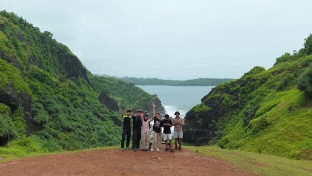 Aerial view of Bukit Pengilon with people on a cliff Indonesia. Aerial view of Bukit Pengilon with people on a cliff Indonesia.