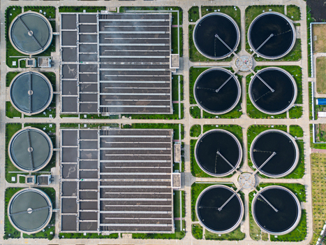 Aerial view of the Sewage Treatment Plant Dhaka WASA featuring circular clarifiers and rectangular aeration tanks Dhaka Dhaka Division Bangladesh. Aerial view of the Sewage Treatment Plant Dhaka WASA featuring circular clarifiers and rectangular aeration tanks Dhaka Dhaka Division Bangladesh.