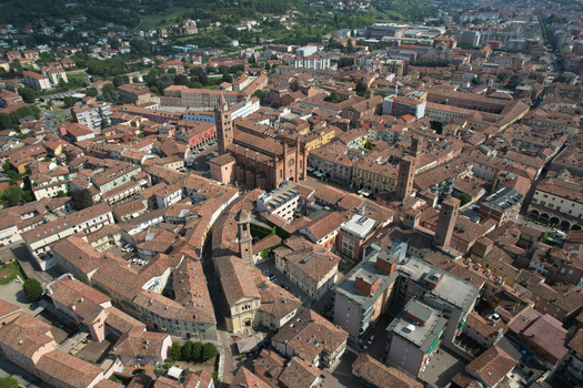 Aerial view of Alba Cathedral and the historic red tiled rooftops of the old town center Alba Piedmont Italy.