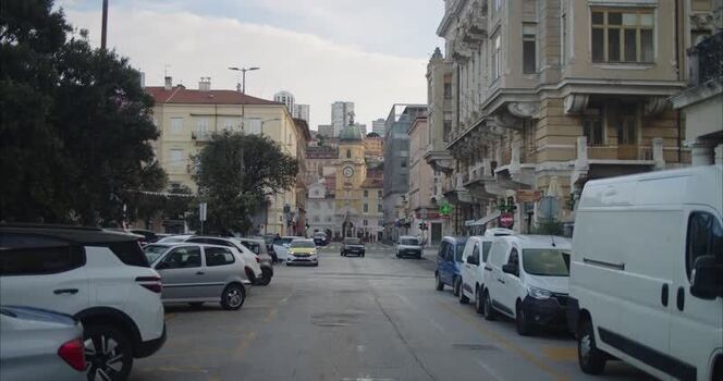 View of the historic City Clock Tower and street in Rijeka Croatia. View of the historic City Clock Tower and street in Rijeka Croatia.