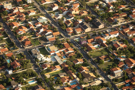 Aerial view of a residential neighborhood with houses swimming pools and streets in Rio de Janeiro Rio de Janeiro Brazil. Aerial view of a residential neighborhood with houses swimming pools and streets in Rio de Janeiro Rio de Janeiro Brazil.