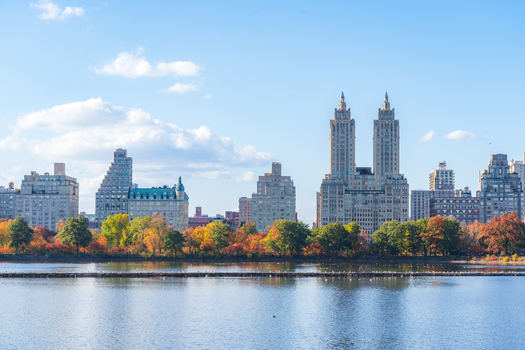 Manhattan United States 08 November 2025 View of Central Park s serene lake reflecting the towering buildings and vibrant autumn foliage under a crisp blue sky. Manhattan United States 08 November 2025 View of Central Park s serene lake reflecting the towering buildings and vibrant autumn foliage under a crisp blue sky.
