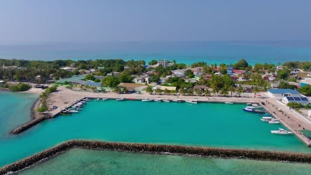Aerial view of island with mosque Maldives.