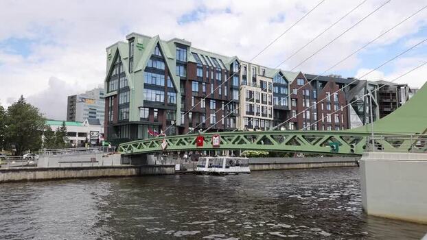 View of modern architecture and green bridge in Kaliningrad Russia.