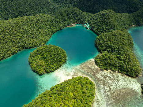 Aerial view of Bucas Grande with lush green islands turquoise lagoons coral reefs and dense tropical vegetation in Siargao Philippines. Aerial view of Bucas Grande with lush green islands turquoise lagoons coral reefs and dense tropical vegetation in Siargao Philippines.