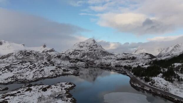 Aerial view of Lofoten mountains and lake in Norway.