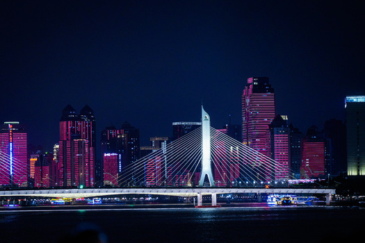Guangzhou Guangdong Province China 22 February 2024 View of the illuminated Liede Bridge spanning the Pearl River at night set against the vibrant skyline. Guangzhou Guangdong Province China 22 February 2024 View of the illuminated Liede Bridge spanning the Pearl River at night set against the vibrant skyline.