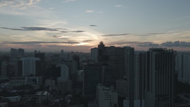 Aerial view of the city skyline at sunset in Philippines.