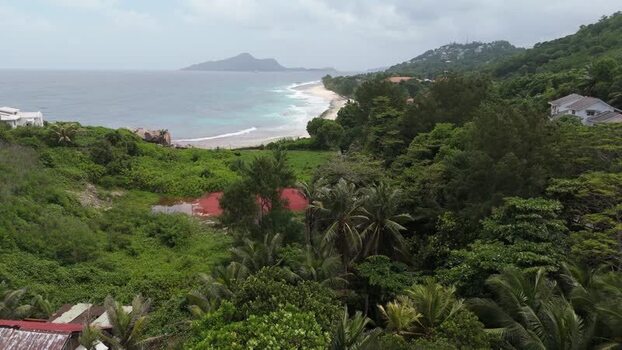 Aerial view of Mahe coastline and tropical forest Seychelles.