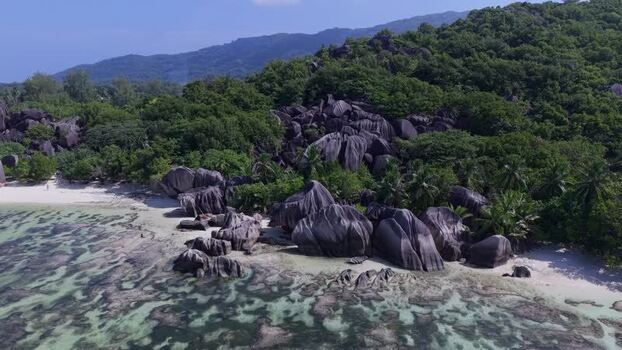 Aerial view of Anse Reunion beach and granite boulders Seychelles.