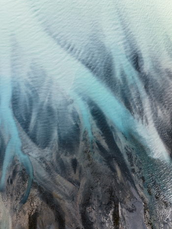 Aerial view of glacial meltwater carves delicate branching patterns across the landscape a dance of turquoise and grey Lake Tekapo New Zealand. Aerial view of glacial meltwater carves delicate branching patterns across the landscape a dance of turquoise and grey Lake Tekapo New Zealand.