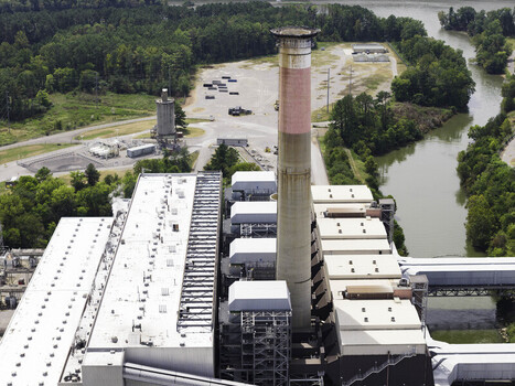 Aerial view of the Gallatin Fossil Plant coal fired power station featuring the tall exhaust stack industrial infrastructure and surrounding greenery in Gallatin TN United States.