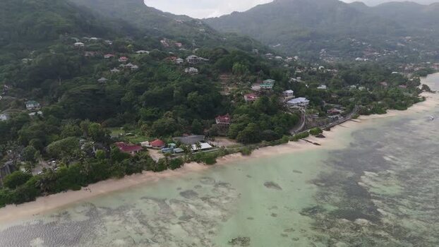 Aerial view of Mahe coastline and tropical hills Seychelles.