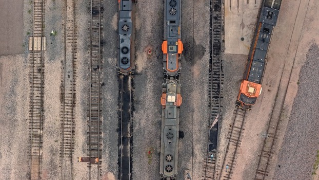 Aerial view of locomotives parked on parallel tracks at a rail yard in Denver Colorado United States. Aerial view of locomotives parked on parallel tracks at a rail yard in Denver Colorado United States.