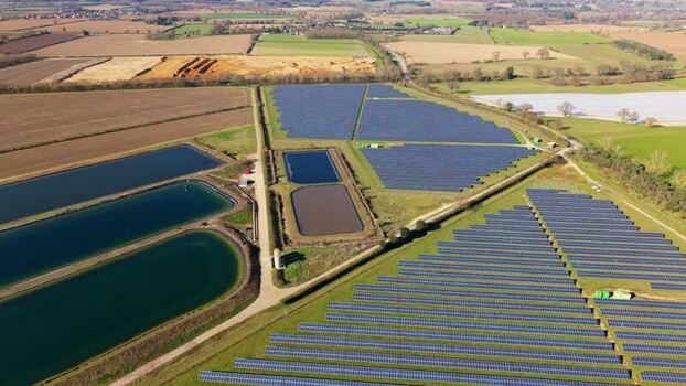 Aerial view of solar panels and water ponds United Kingdom.