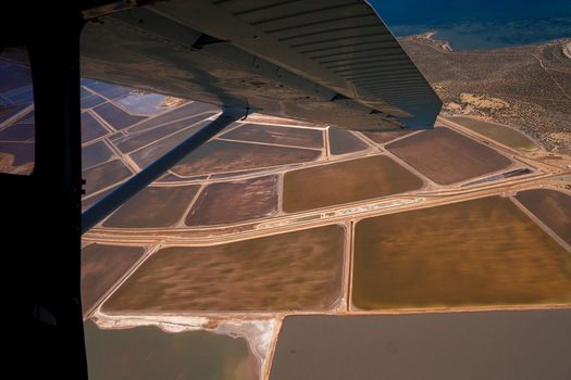 Aerial view of the salt ponds at Useless Loop showing industrial patterns and varying water colors from the air in Kalbarri Western Australia Australia. Aerial view of the salt ponds at Useless Loop showing industrial patterns and varying water colors from the air in Kalbarri Western Australia Australia.
