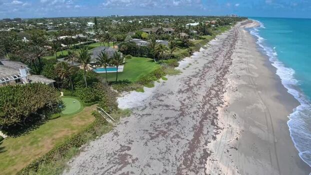 Aerial view of luxury coastal houses and ocean United States. Aerial view of luxury coastal houses and ocean United States.