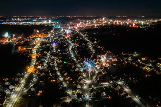 Aerial view of fireworks exploding over the illuminated rooftops and streets of the town at night in Forchheim Bavaria Germany. Aerial view of fireworks exploding over the illuminated rooftops and streets of the town at night in Forchheim Bavaria Germany.