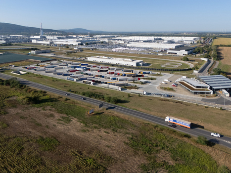 Aerial view of the Volkswagen Slovakia factory in Devinska Nova Ves with its large truck parking lot and industrial buildings in Bratislava Bratislavsky kraj Slovakia. Aerial view of the Volkswagen Slovakia factory in Devinska Nova Ves with its large truck parking lot and industrial buildings in Bratislava Bratislavsky kraj Slovakia.