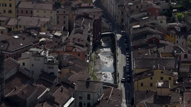 Aerial view of Carrara rooftops and river in Italy. Aerial view of Carrara rooftops and river in Italy.