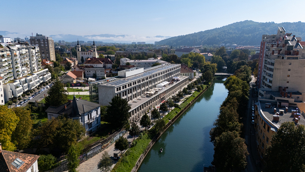 Aerial view of the Center Rog building situated along the Ljubljanica river surrounded by urban architecture and lush trees in Ljubljana Ljubljana Slovenia. Aerial view of the Center Rog building situated along the Ljubljanica river surrounded by urban architecture and lush trees in Ljubljana Ljubljana Slovenia.