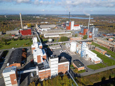Oulu Finland 25 September 2026 Aerial view of Takalaanila industrial area with large factory buildings smokestacks storage tanks and surrounding forest under a blue sky. Oulu Finland 25 September 2026 Aerial view of Takalaanila industrial area with large factory buildings smokestacks storage tanks and surrounding forest under a blue sky.