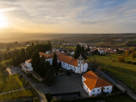 Vila Pouca da Beira Portugal 31 December 2023 Aerial view of Lam Hotel Convento do Desagravo with its historic architecture and orange roofs during a golden sunset. Vila Pouca da Beira Portugal 31 December 2023 Aerial view of Lam Hotel Convento do Desagravo with its historic architecture and orange roofs during a golden sunset.