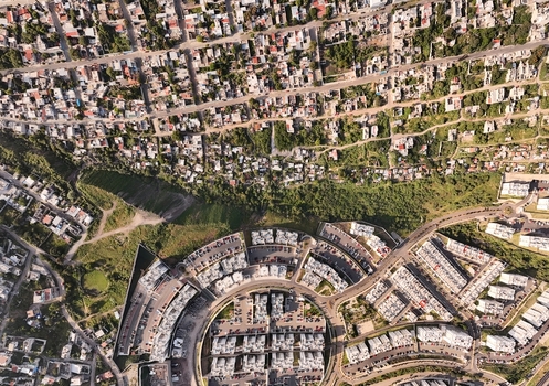 Santiago de Queretaro Queretaro Mexico 25 September 2026 Aerial view of the Anillo Vial Fray Junipero Serra area showing a circular residential complex and surrounding urban housing.