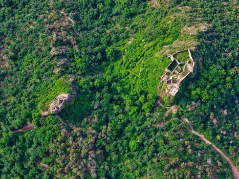 Aerial view of the medieval castle ruins of Saint Ulrich and Girsberg perched on a lush green hill in Ribeauville Grand Est France. Aerial view of the medieval castle ruins of Saint Ulrich and Girsberg perched on a lush green hill in Ribeauville Grand Est France.