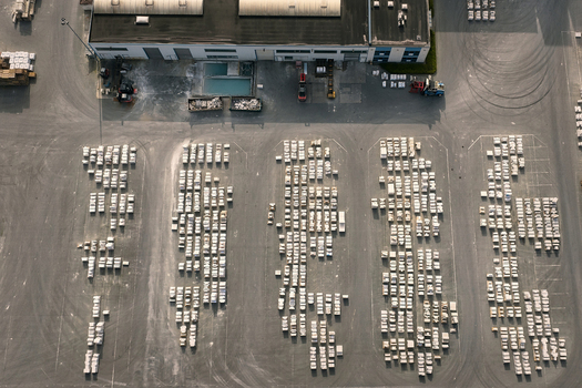 Aerial view of an industrial facility with rows of organized pallets stored in an outdoor yard in Dulmen North Rhine Westphalia Germany. Aerial view of an industrial facility with rows of organized pallets stored in an outdoor yard in Dulmen North Rhine Westphalia Germany.