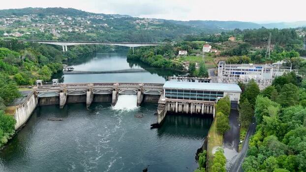 Aerial view of Velle Dam and hydroelectric substation on Minho River Spain. Aerial view of Velle Dam and hydroelectric substation on Minho River Spain.
