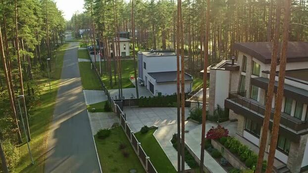 Aerial view of modern house in pine forest Latvia.