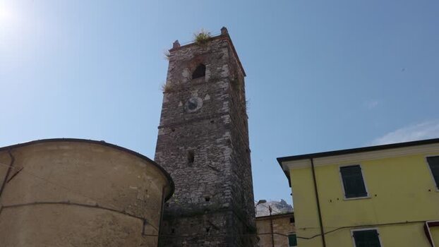 Aerial view of the historic stone bell tower in Colonnata Italy. Aerial view of the historic stone bell tower in Colonnata Italy.