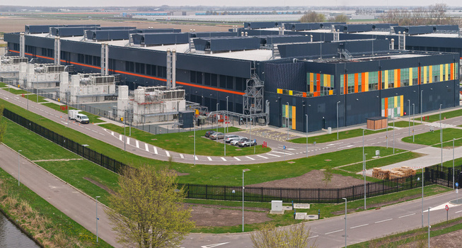 Middenmeer Netherlands 15 April 2026 Aerial view of the Microsoft data center campus with industrial buildings energy generators and surrounding green fields.