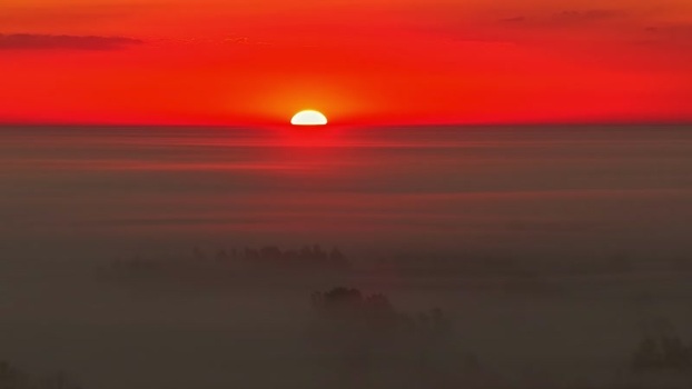 Aerial view of sunset over foggy landscape LATVIA. Aerial view of sunset over foggy landscape LATVIA.