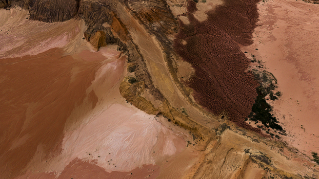 Aerial view of colorful salt production patterns and mineral deposits in the earth showcasing vibrant pink orange and deep red textures in Kalbarri Western Australia Australia. Aerial view of colorful salt production patterns and mineral deposits in the earth showcasing vibrant pink orange and deep red textures in Kalbarri Western Australia Australia.
