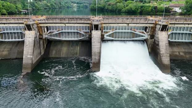 Aerial view of the Velle Dam spillway on the Mino River Spain. Aerial view of the Velle Dam spillway on the Mino River Spain.