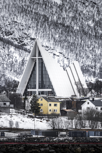 Tromso Norway 11 March 2026 View of the Arctic Cathedral with its modern triangular architecture and white facade against a snowy mountain backdrop. Tromso Norway 11 March 2026 View of the Arctic Cathedral with its modern triangular architecture and white facade against a snowy mountain backdrop.